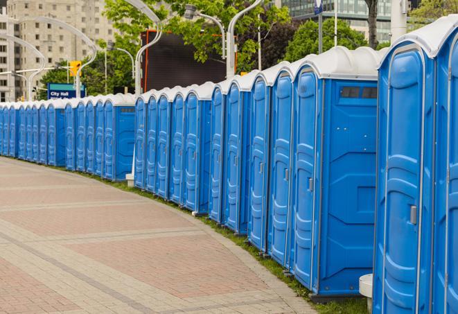 a row of portable restrooms at an outdoor special event, ready for use in Duncanville